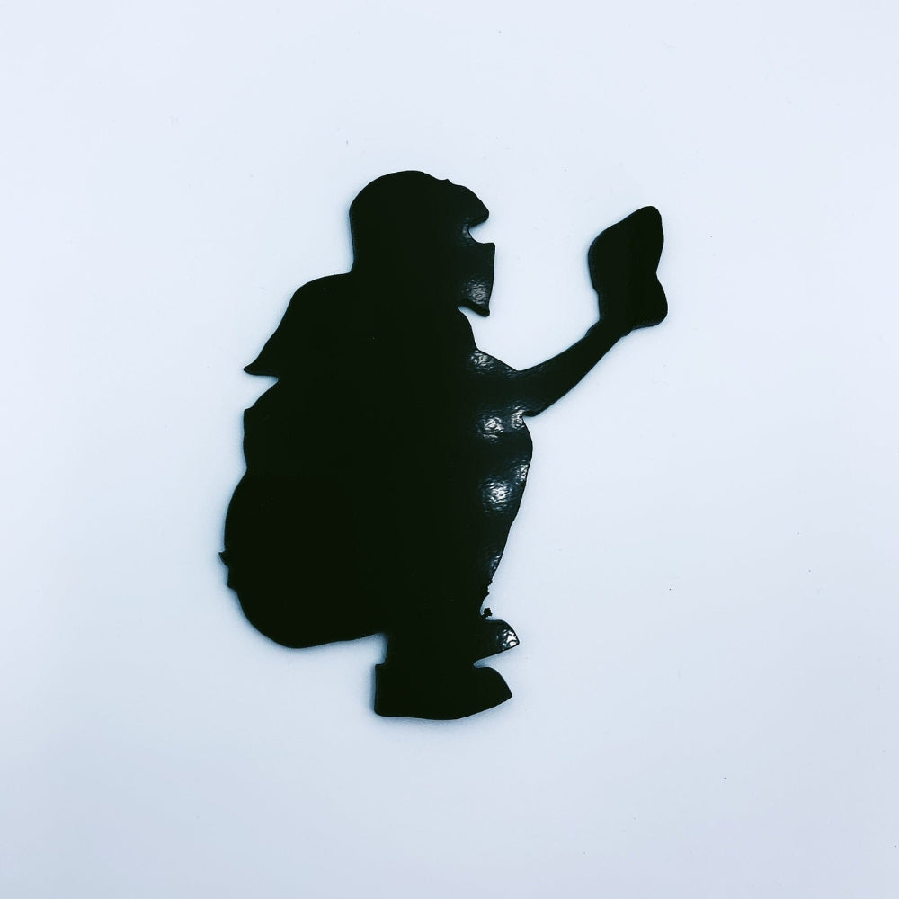 Precut glass shape of a baseball backcatcher in black glass.