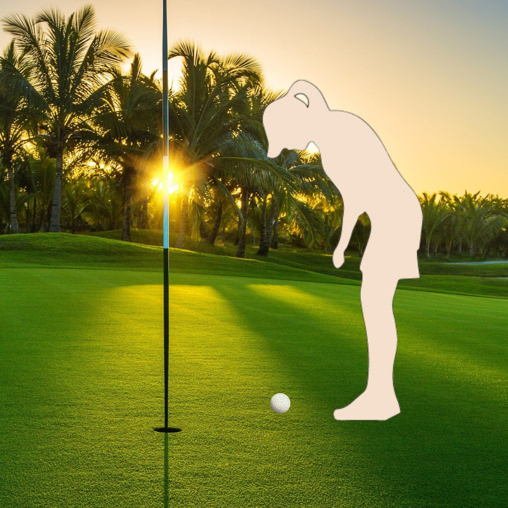 Precut glass shape of a female golfer on a golf course.