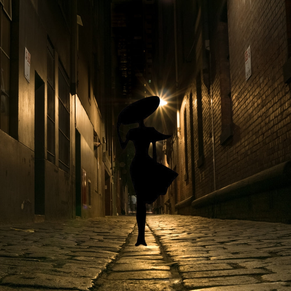 Precut glass shape of a lady with a hat in a mysterious alley.