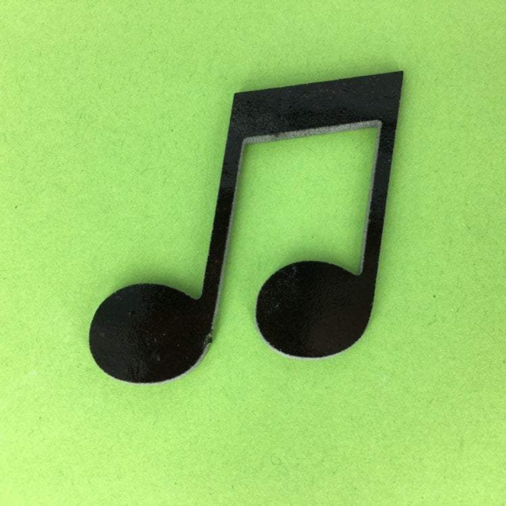 Precut glass shape of a quarter note in black glass.