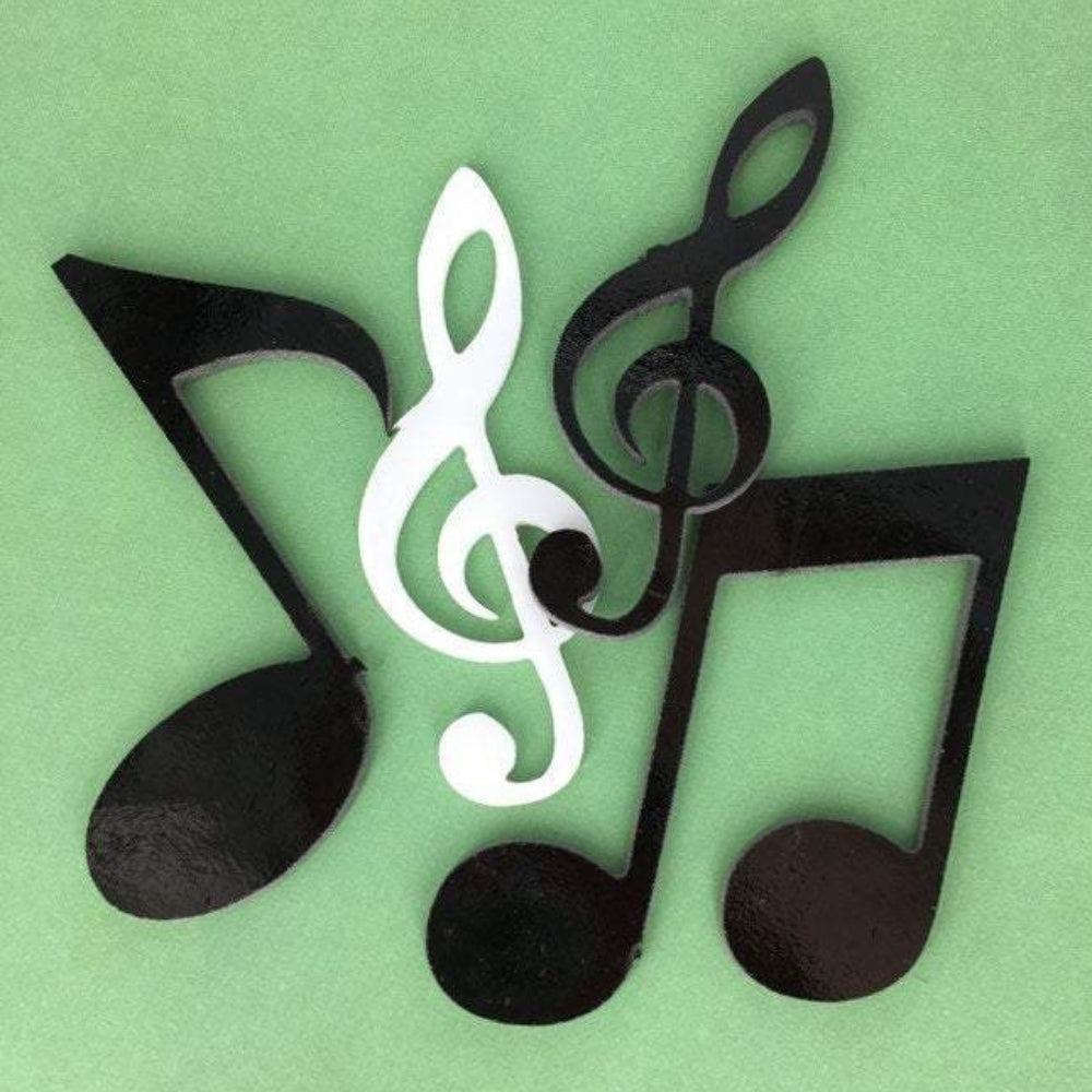 Precut glass shape of music notes in black and white glass.