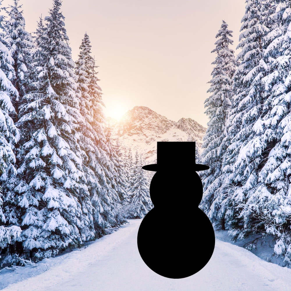 Precut glass shape of a snowman with a hat in the woods.