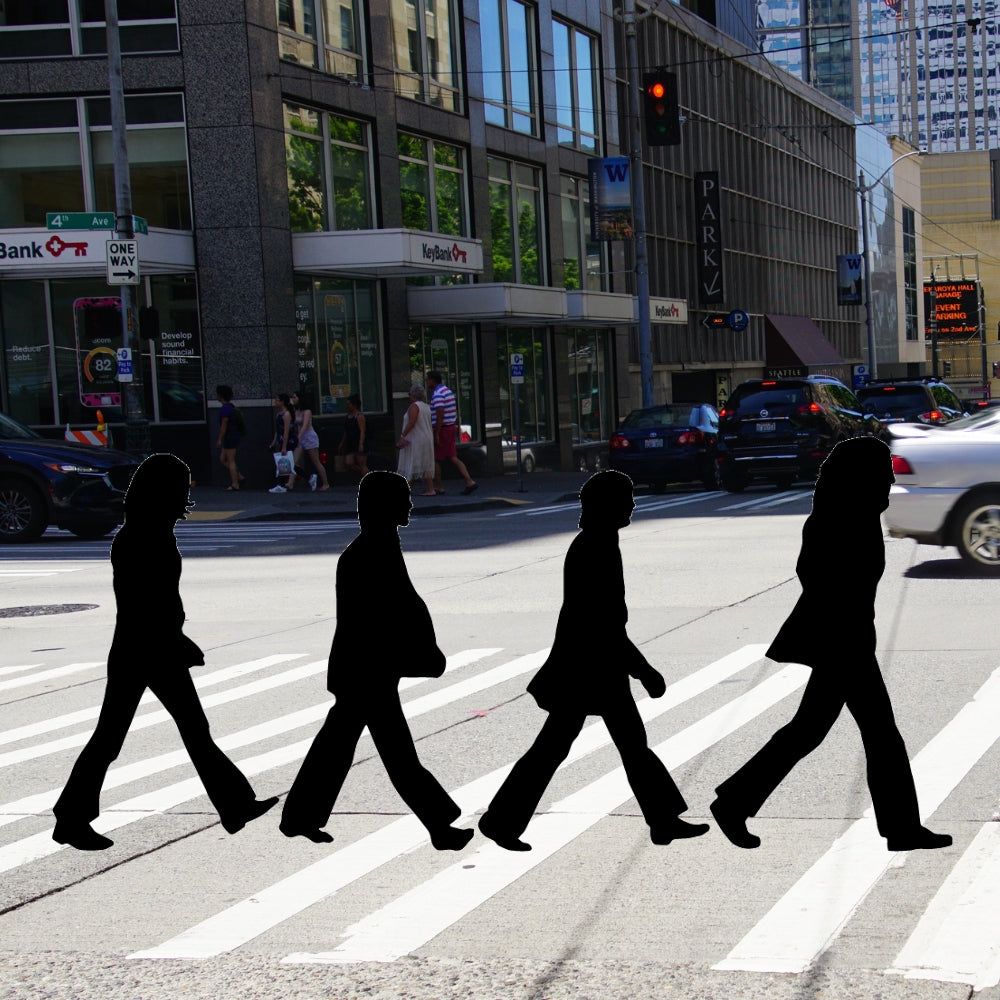 Precut glass shape of The Beatles on the street.