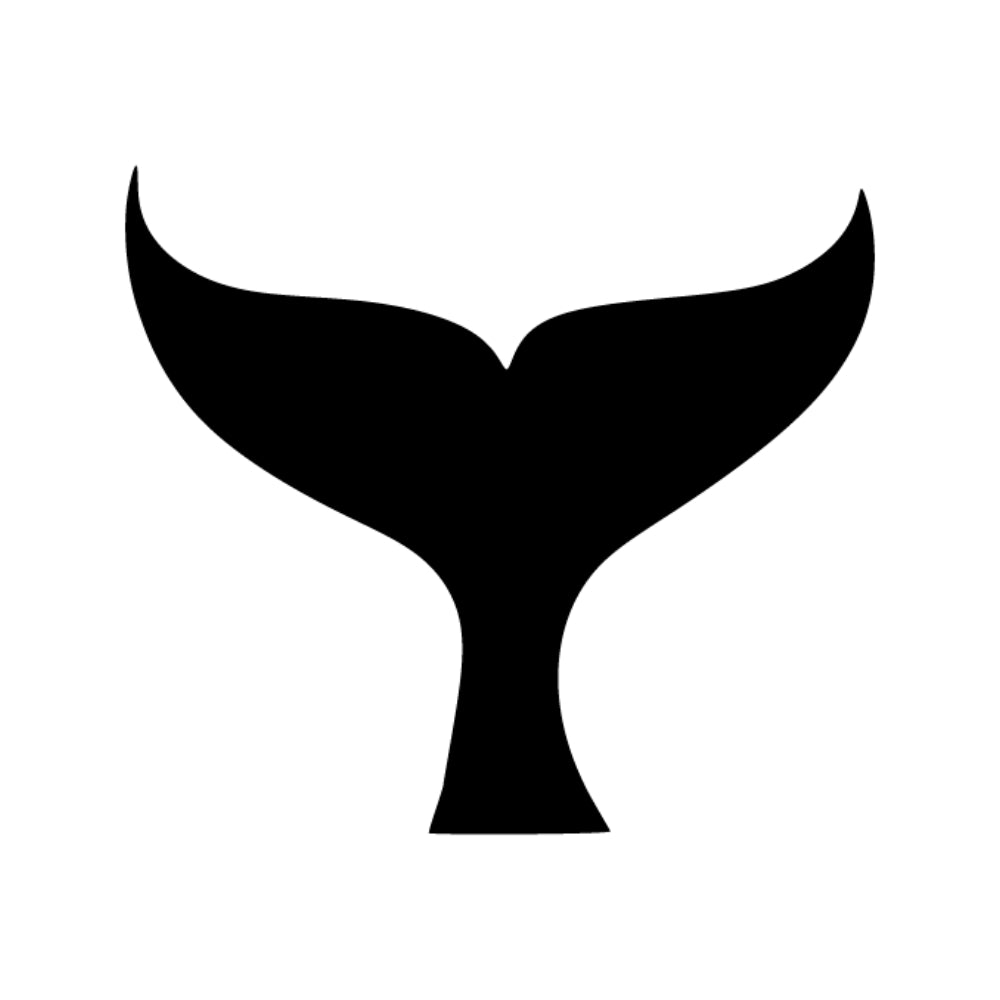 Precut glass shape of a whale tail in black.