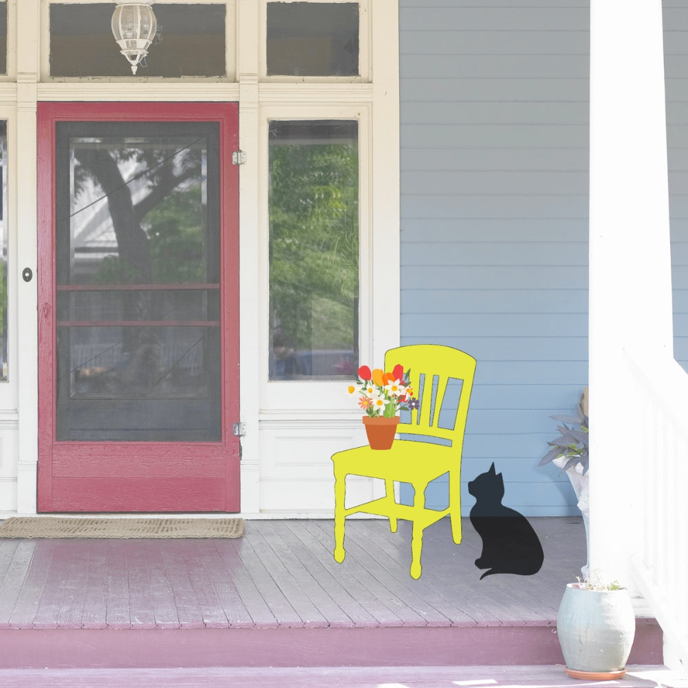 Precut glass shape of a wooden chair on a porch.