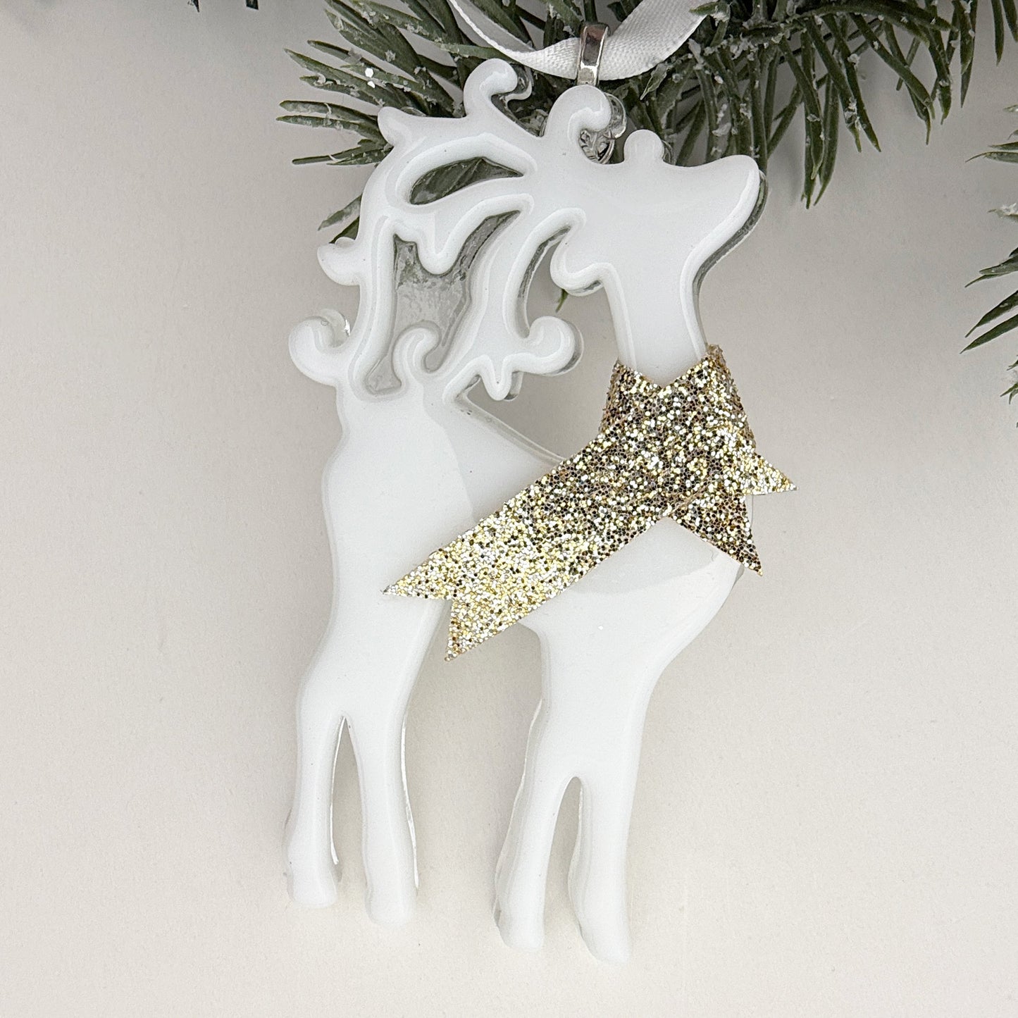 Elegant white reindeer Christmas ornament with a sparkling gold scarf, handmade holiday décor for all-white trees.