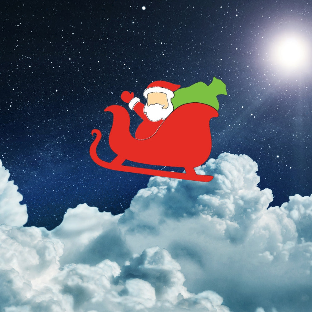 Precut Oceanside Glass Santa in his sleigh with his green toy bag on a background of night sky.
