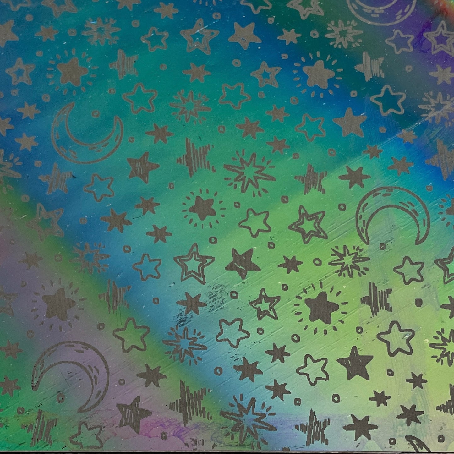 Stars and moon etched dichroic glass