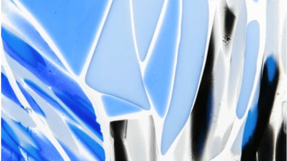 Fused Glass in a variety of blue, grey black and white art glass.