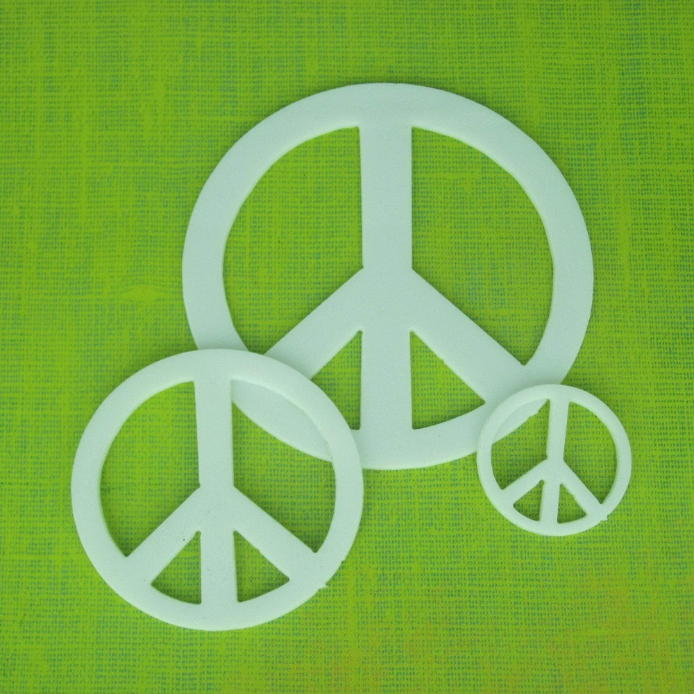 Precut glass shape of a peace sign in white glass.