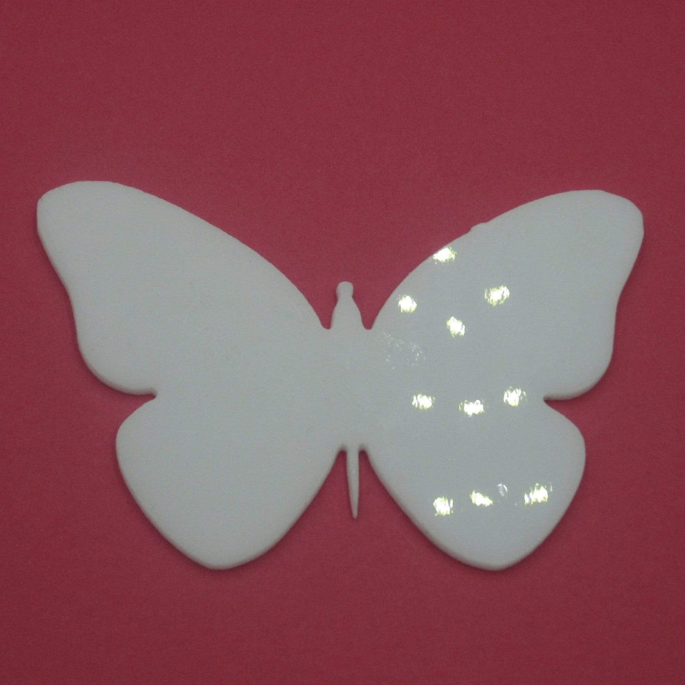 Precut glass shape of butterfly.