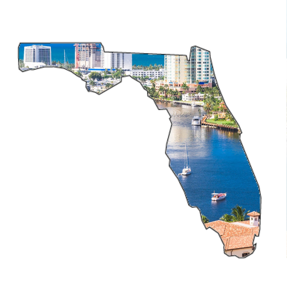 Precut glass shape of Florida with a landscape within it.