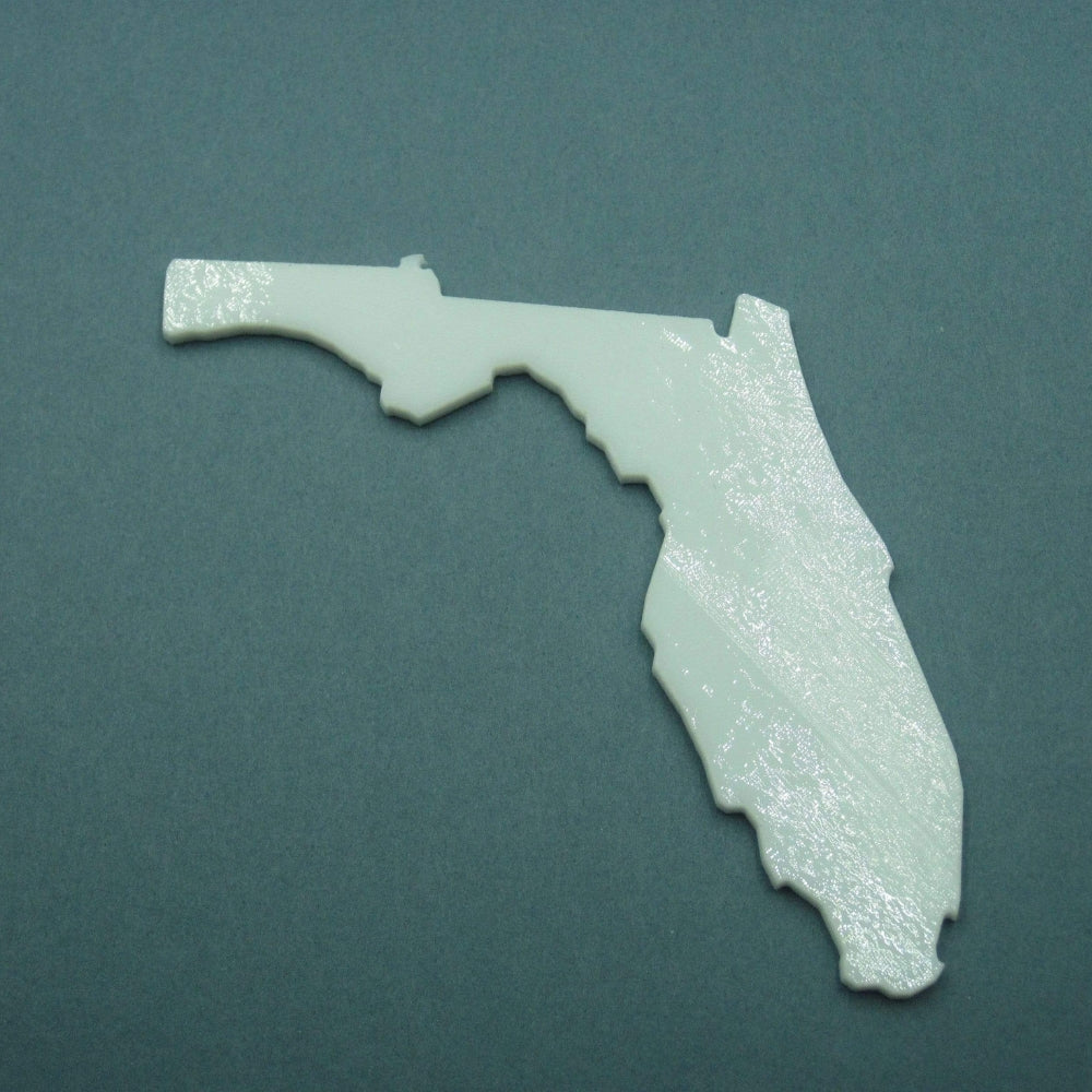 Precut glass shape of Florida in white glass.