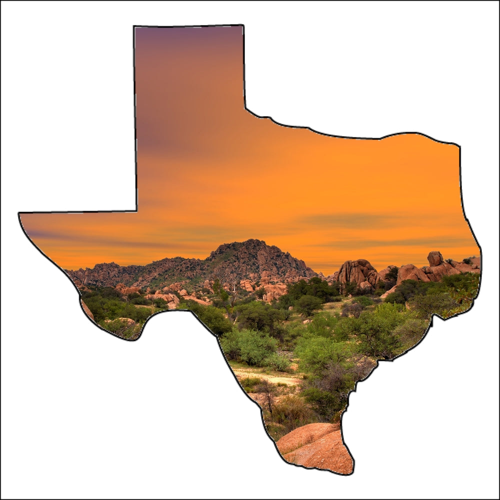 Precut glass shape of Texas with a sunset landscape.