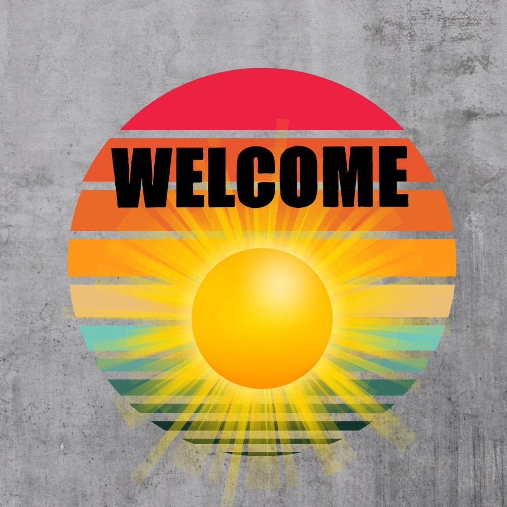 Precut glass shape of the word WELCOME with a sunset.