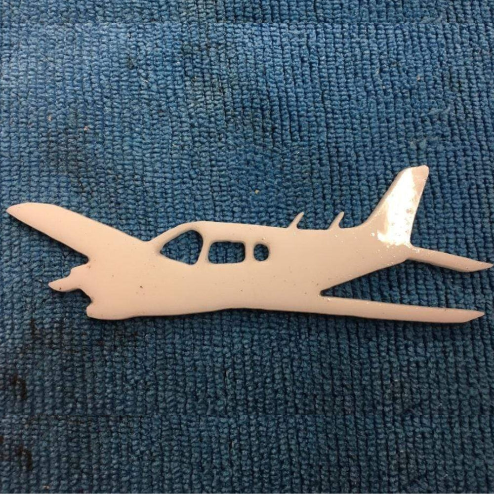 Precut glass shape of an airplane in white glass.