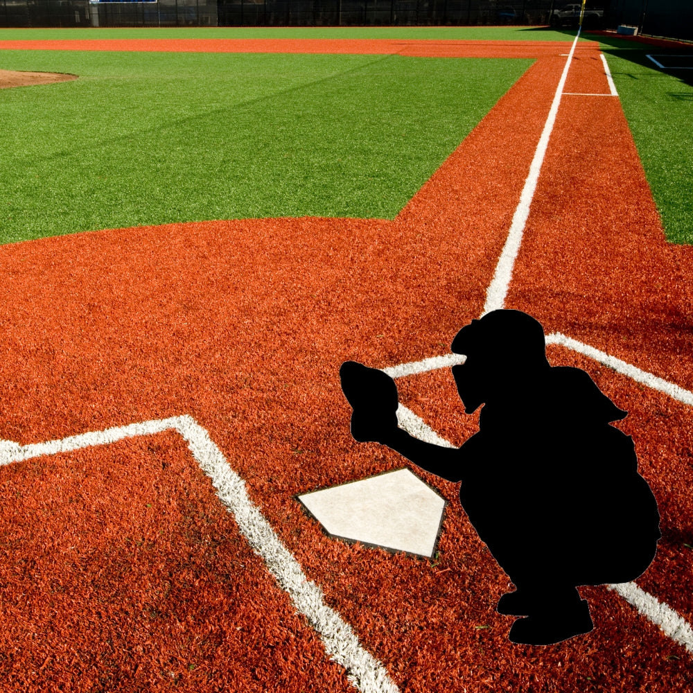 Precut glass shape of a baseball backcatcher on a field.