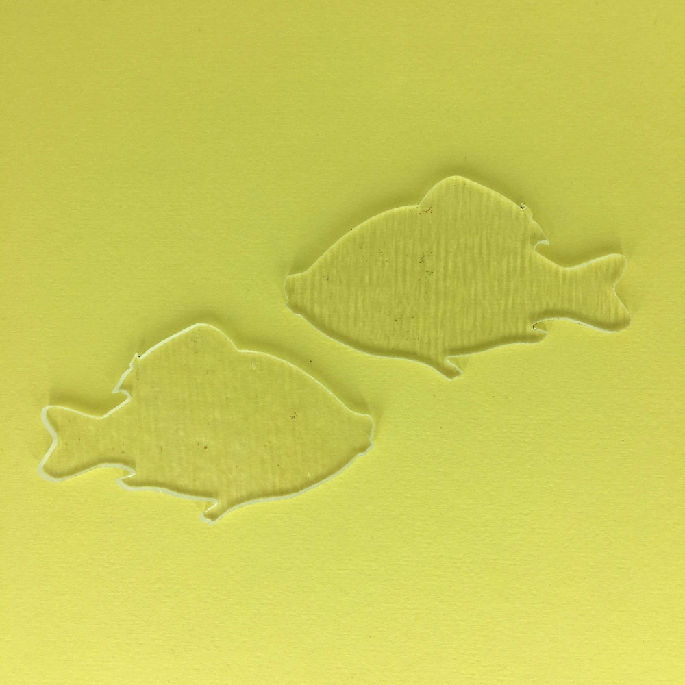 Precut glass shape of fish.