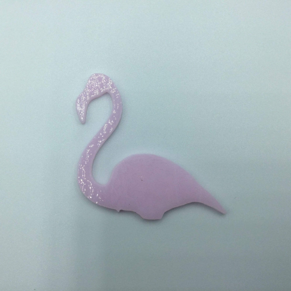 Precut glass shape of flamingo.