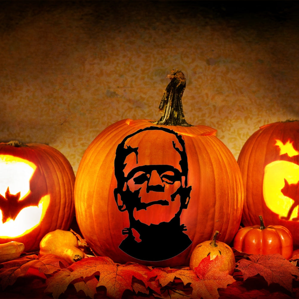 Precut glass shape of a frankenstein head on a pumpkin.