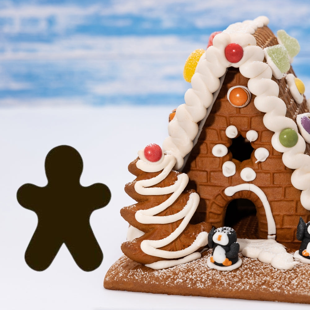 Precut glass shape of gingerbread man with gingerbread house.