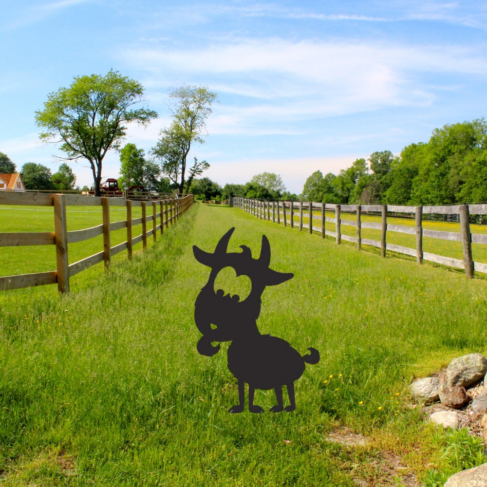 Precut glass shape of a goat in pasture.