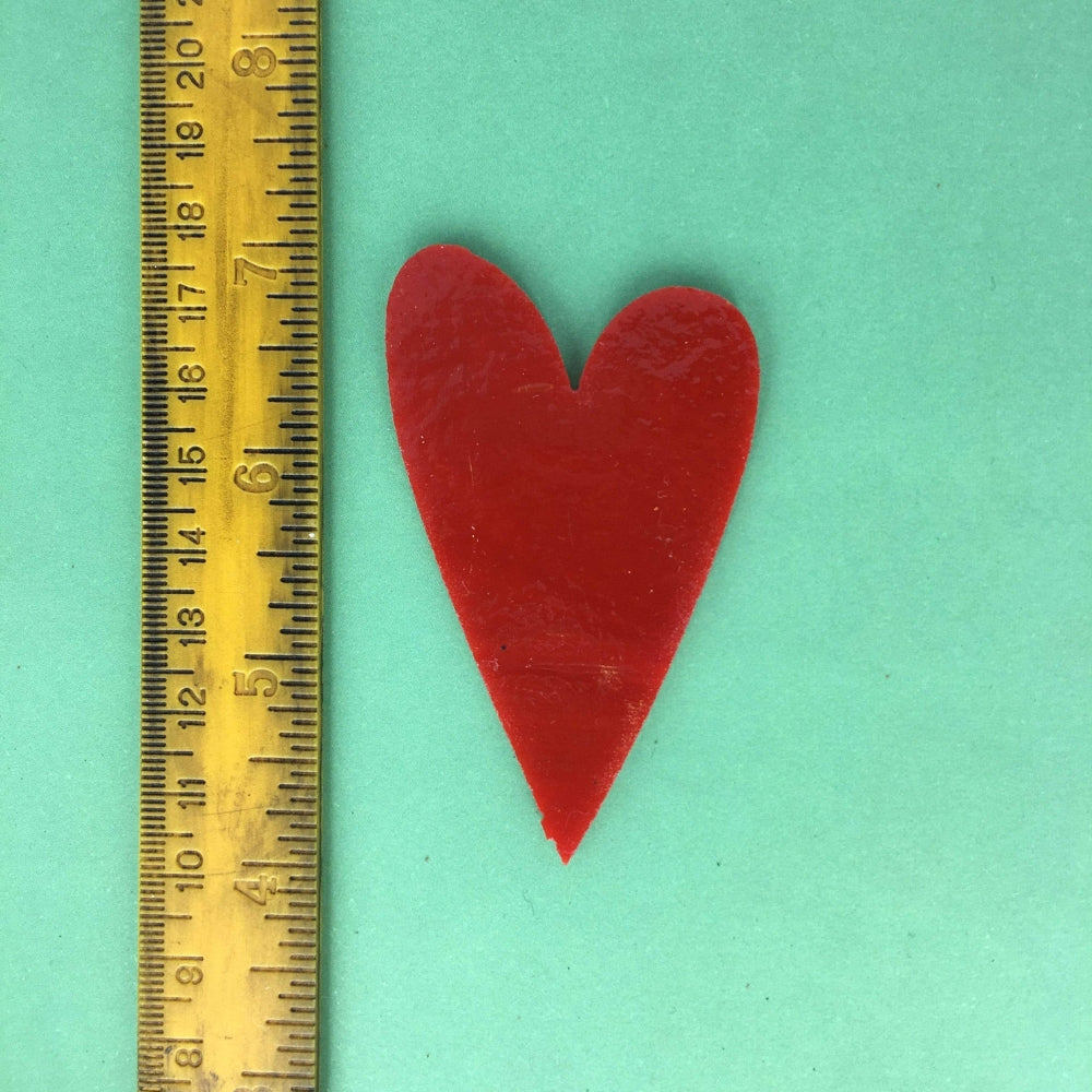 Precut glass shape of a heart showing size.