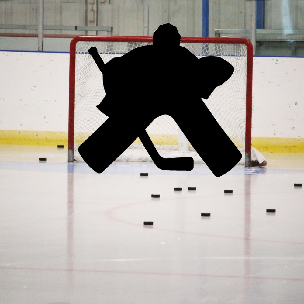 Precut glass shape of a hockey goalie on the ice.