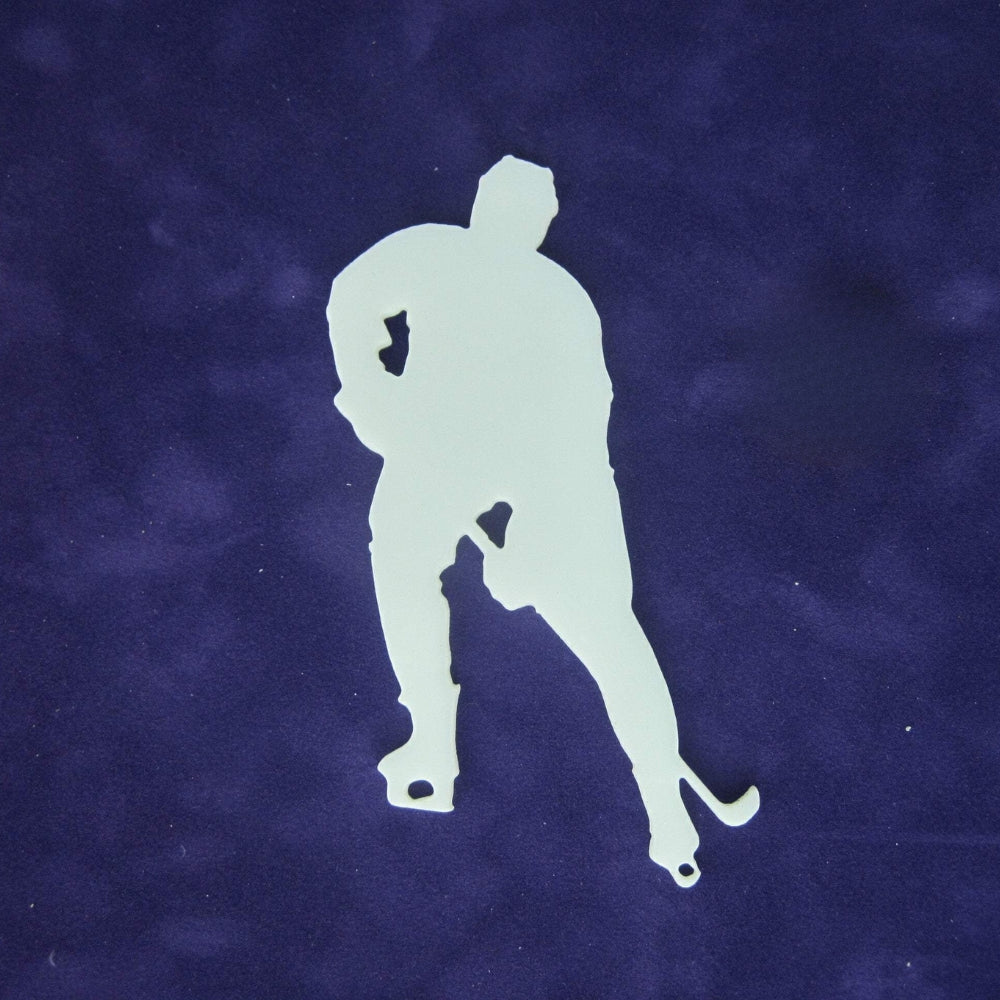 Precut glass shape of a hockey player in white glass.