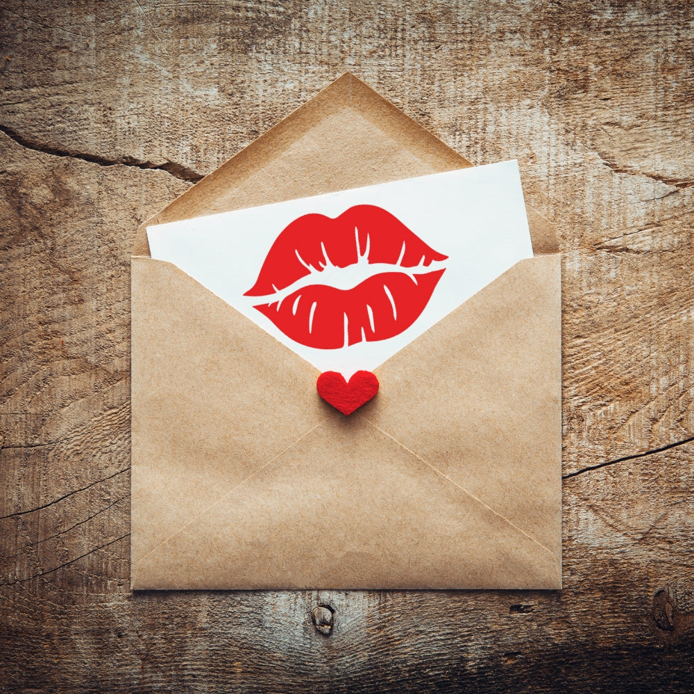 Precut glass shape of lipstick kiss in a love letter.