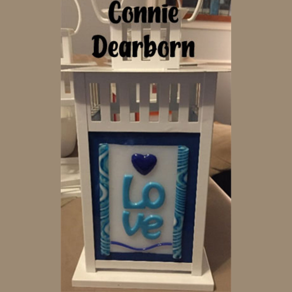 Precut glass shape of the word Love in an art piece by Connie Dearborn.