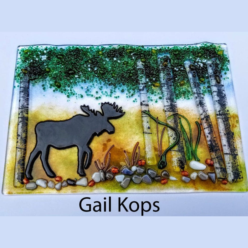 Precut glass shape of a moose in art piece by Gail Kops.