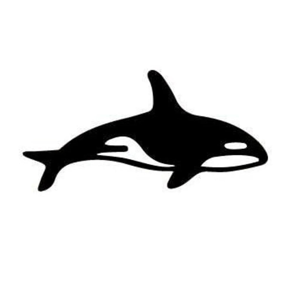 Precut glass shape of an orca in black and white glass.