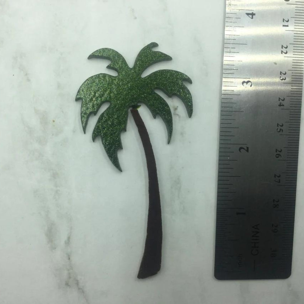 Precut glass shape of a palm tree in green and brown glass that is 3.5" Tall.