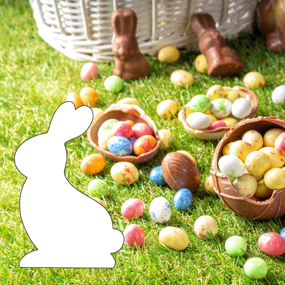 Precut glass shape of a rabbit in a pile of easter eggs.