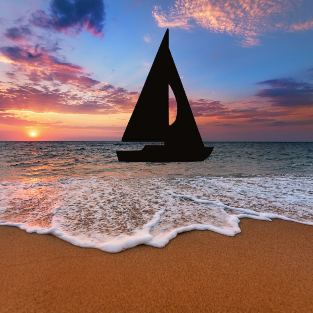 Precut glass shape of a sailboat on the ocean.