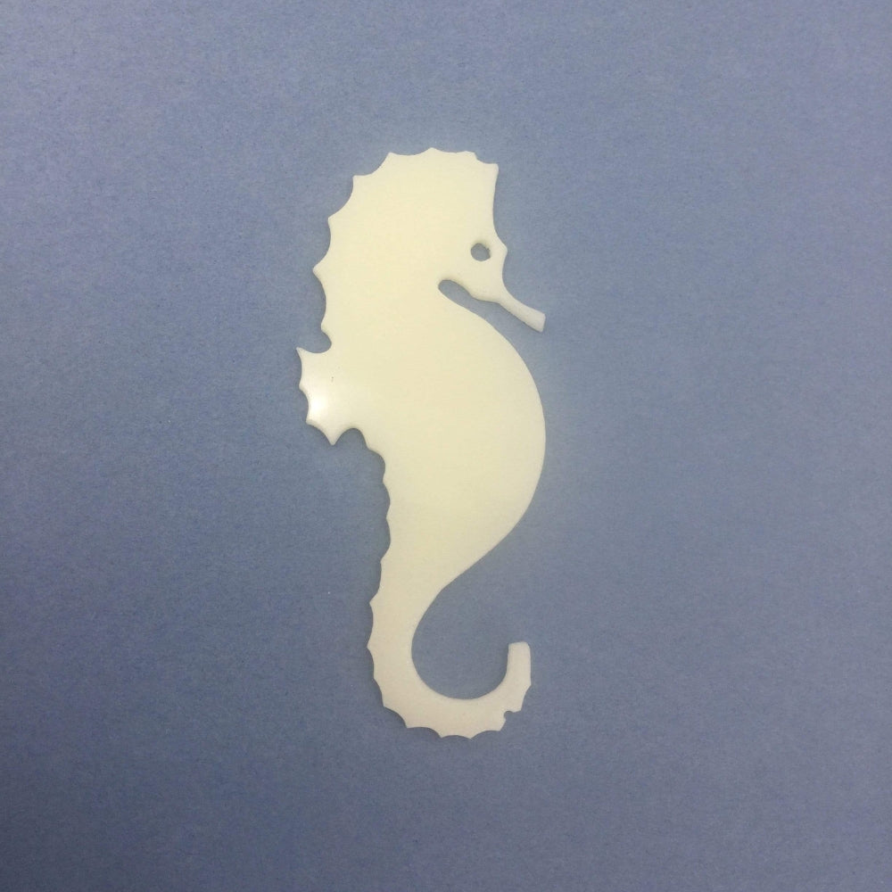 Precut glass shape of a seahorse in white glass.