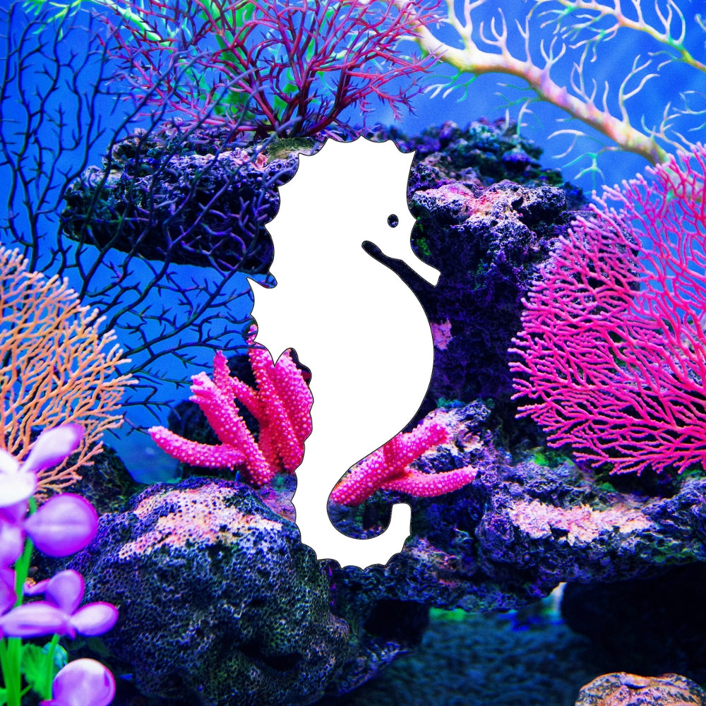 Precut glass shape of a seahorse in a coral reef.