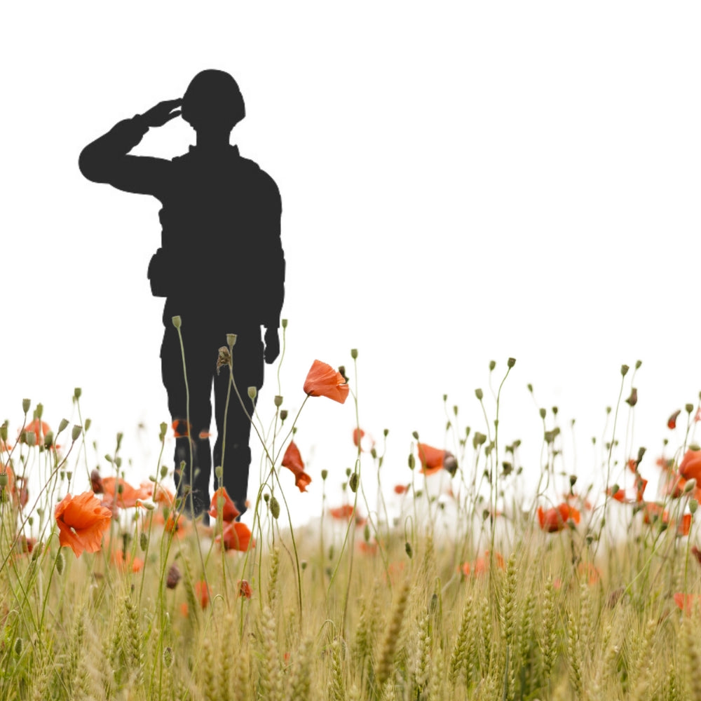 Precut glass shape of a soldier in a field of poppies.