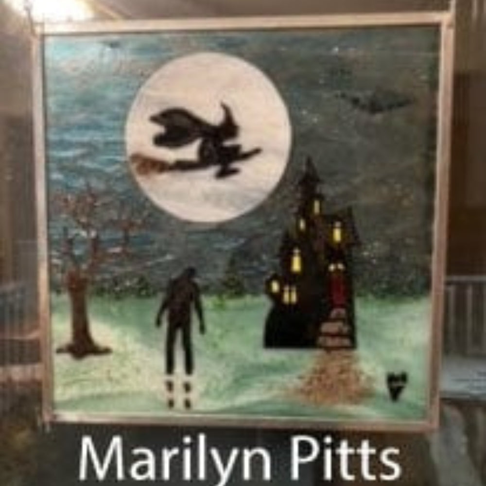 Precut glass shape of a witch in an art piece by Marilyn Pitts.