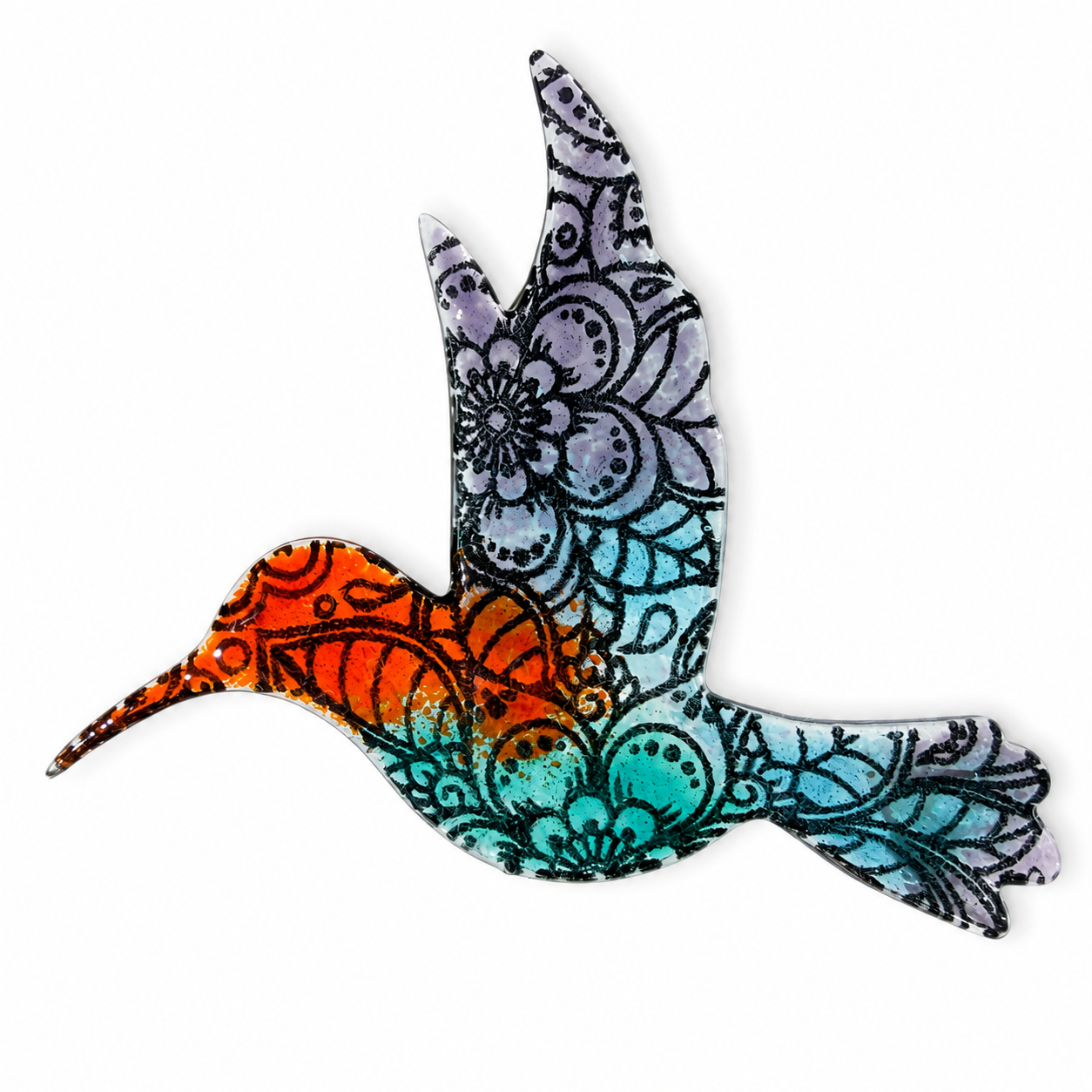 Colorful fused glass bird featuring a floral paisley silk screen pattern in orange, turquoise and soft purple on a white background.