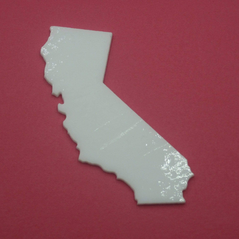 Precut glass shape of California in white glass.