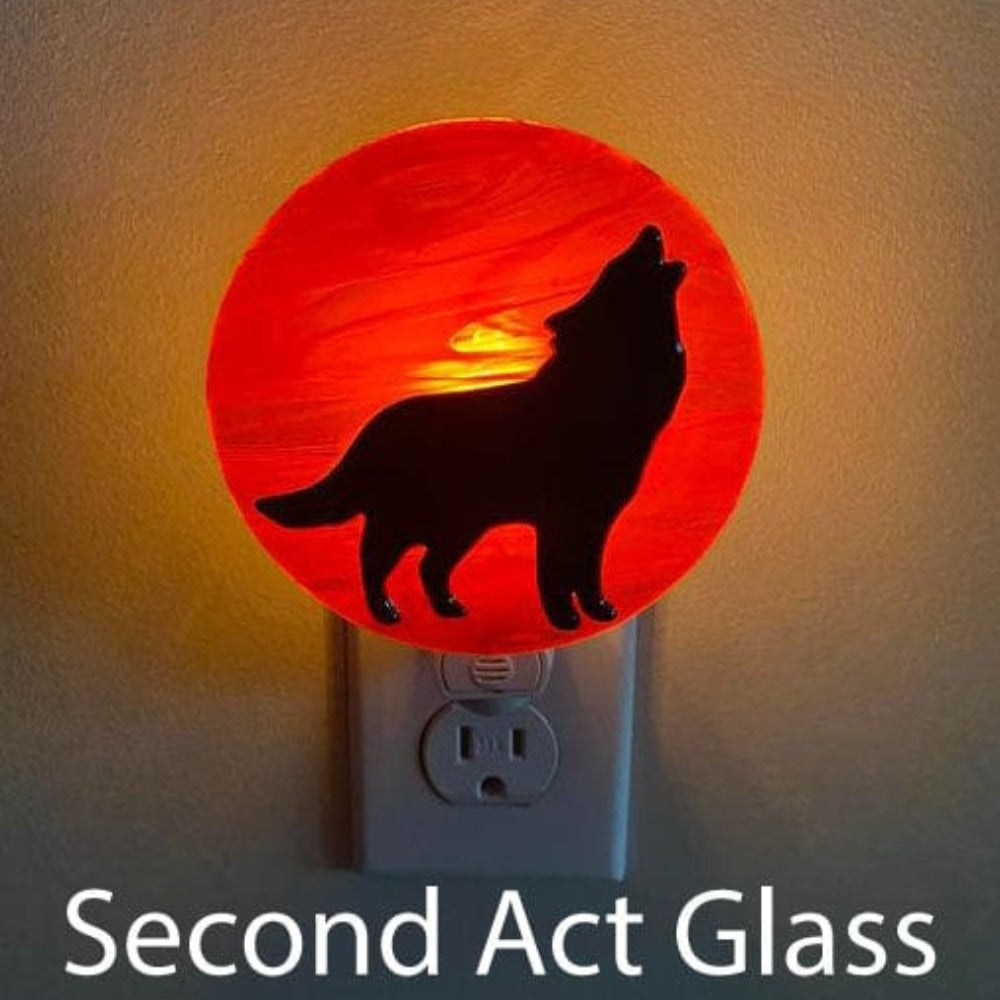 Precut glass shape of a wolf in an art piece by Second Act Glass.