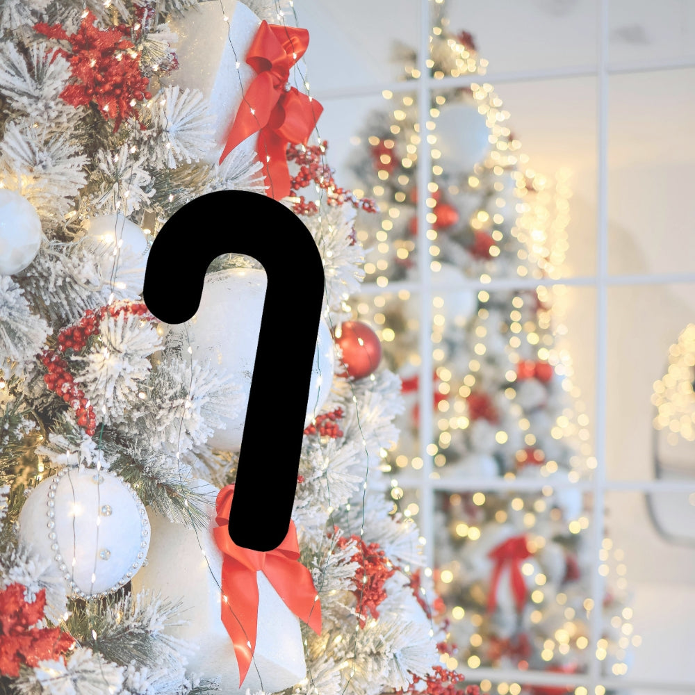 Black candy cane glass precut featured on a white and red Christmas tree — COE 96 fusible glass for holiday glass art