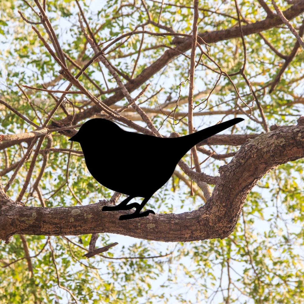 Precut glass shape of bird on a branch.